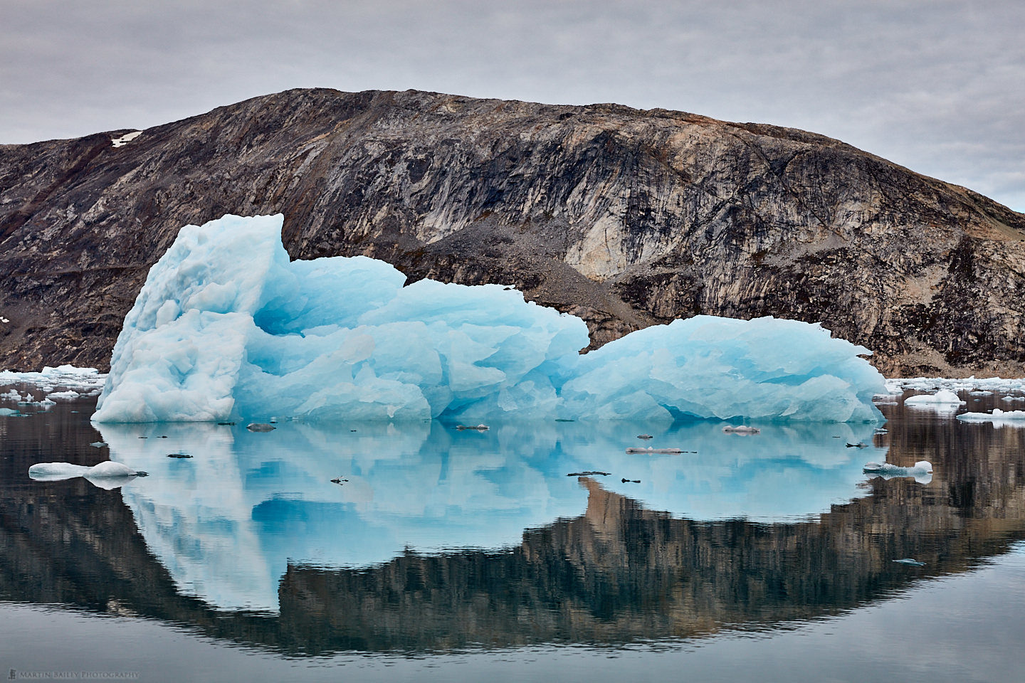 Iceberg and Mountain Reflection